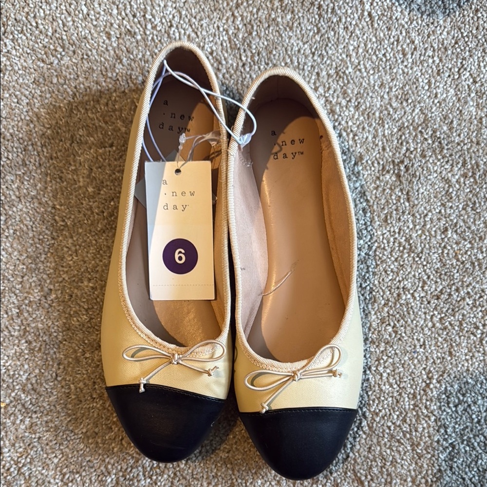 A New Day Cream and Black Ballet Flats with Bow Detail